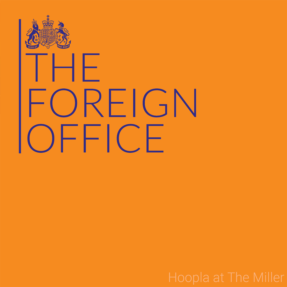 Logo of The Foreign Office comedy night, made after the Home Office's logo. You can see a lion and a unicorn hugging a heraldic symbol and read the words The Foreign Office in blue over an orange background. On the low right corner, you can also read Hoopla at The Miller